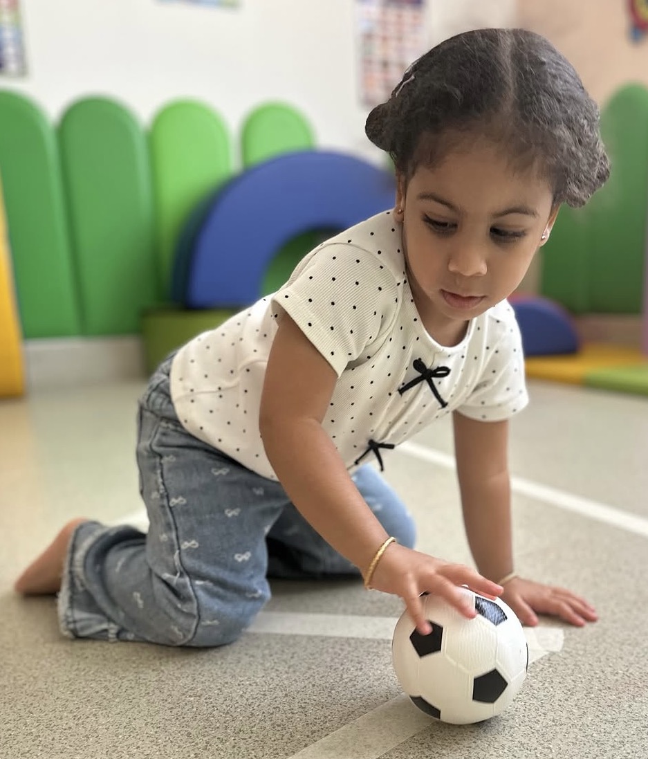 Child playing with a ball