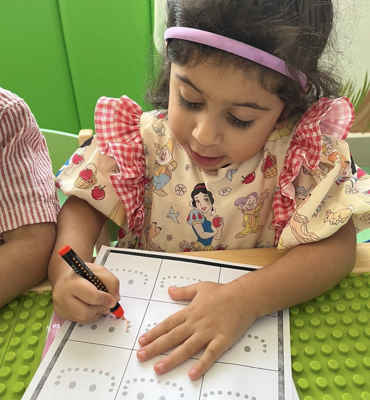 Child tracing letters